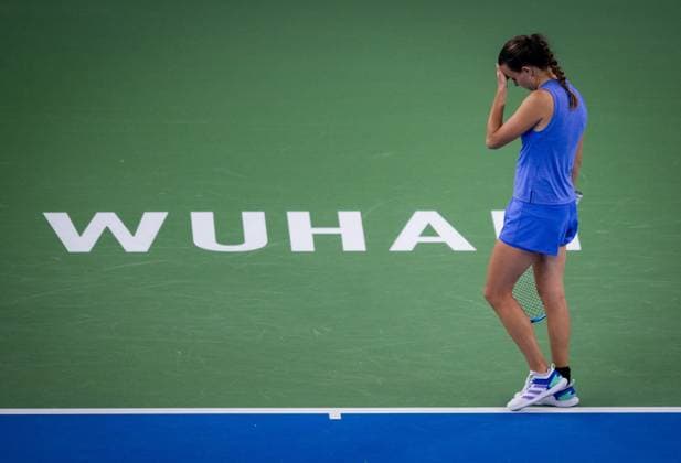 (241007) -- WUHAN, Oct. 7, 2024 -- Clara Burel of France reacts during the women s singles round of 64 match against Yuan Yue of China at the 2024 Wuhan Open tennis tournament in Wuhan, capital of central China s Hubei Province, Oct. 7, 2024. ) (SP)CHINA-WUHAN-TENNIS-WUHAN OPEN-WOMEN S SINGLES (CN) HuxJingwen 
