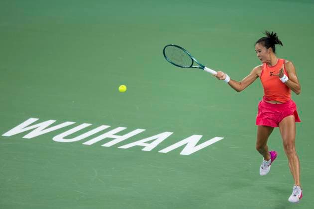 (241007) -- WUHAN, Oct. 7, 2024 -- Yuan Yue of China hits a return during the women s singles round of 64 match against Clara Burel of France at the 2024 Wuhan Open tennis tournament in Wuhan, capital of central China s Hubei Province, Oct. 7, 2024. ) (SP)CHINA-WUHAN-TENNIS-WUHAN OPEN-WOMEN S SINGLES (CN) WuxZhizun 