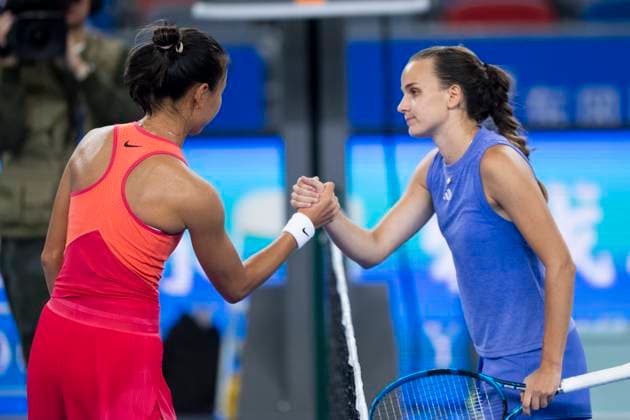 (241007) -- WUHAN, Oct. 7, 2024 -- Clara Burel (R) of France and Yuan Yue of China shake hands after their women s singles round of 64 match at the 2024 Wuhan Open tennis tournament in Wuhan, capital of central China s Hubei Province, Oct. 7, 2024. ) (SP)CHINA-WUHAN-TENNIS-WUHAN OPEN-WOMEN S SINGLES (CN) WuxZhizun 