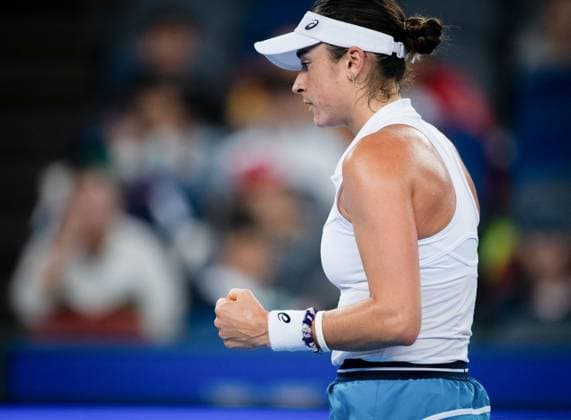 (241007) -- WUHAN, Oct. 7, 2024 -- Caroline Dolehide of the United States celebrates scoring during the singles round of 64 match against Wang Xinyu of China at the 2024 WTA, Tennis Damen Wuhan Open tennis tournament in Wuhan, capital of central China s Hubei Province, Oct. 7, 2024. ) (SP)CHINA-WUHAN-TENNIS-WTA-WUHAN OPEN-SINGLES (CN) HuxJingwen 