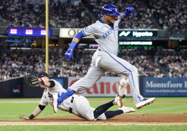 Kansas City RoyalsYuli Gurriel reaches first past New York Yankees first baseman Jon Berti on a throwing error by Royals third baseman Jazz Chisholm Jr. in the sixth inning in game two of the MLB, Baseball Herren, USA ALDS at Yankee Stadium in New York City on Monday, October 7, 2024.  NYP20241007829 JOHNxANGELILLO