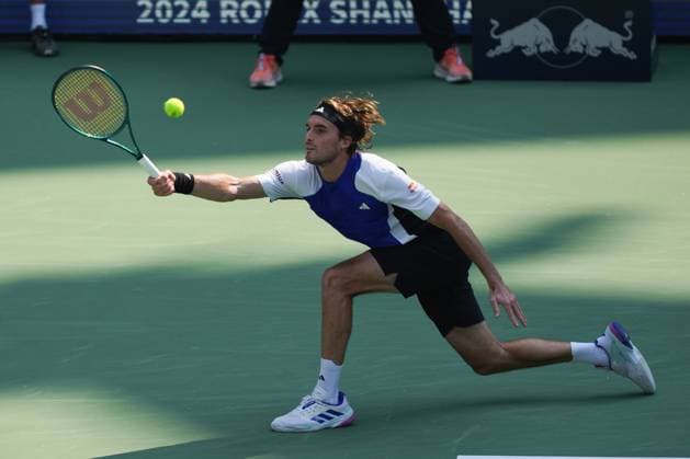 (241008) -- SHANGHAI, Oct. 8, 2024 -- Stefanos Tsitsipas hits a return during the men s singles round of 32 match between Stefanos Tsitsipas of Greece and Alexandre Muller of France at the ATP, Tennis Herren World Tour Shanghai Masters tennis tournament in Shanghai, east China, Oct. 8, 2024. ) (SP)CHINA-SHANGHAI-TENNIS-ATP TOUR-SHANGHAI MASTERS(CN) XuxYanan 