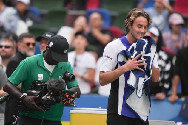 (241008) -- SHANGHAI, Oct. 8, 2024 -- Stefanos Tsitsipas (R) reacts after signing an autograph on the camera after the men s singles round of 32 match between Stefanos Tsitsipas of Greece and Alexandre Muller of France at the ATP, Tennis Herren World Tour Shanghai Masters tennis tournament in Shanghai, east China, Oct. 8, 2024. ) (SP)CHINA-SHANGHAI-TENNIS-ATP TOUR-SHANGHAI MASTERS(CN) XuxYanan 