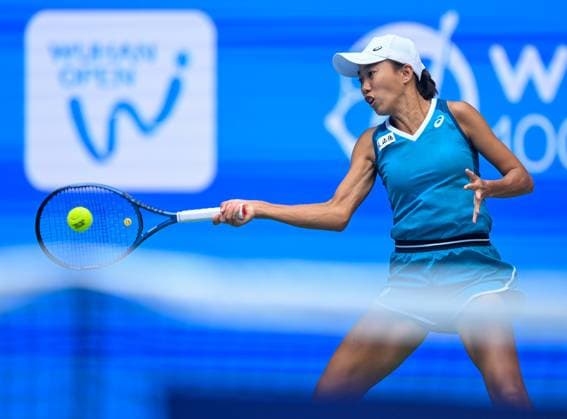 (241008) -- WUHAN, Oct. 8, 2024 -- Zhang Shuai of China hits a return during the women s singles round of 64 match against Yulia Putintseva of Kazakhstan at the 2024 Wuhan Open tennis tournament in Wuhan, capital of central China s Hubei Province, Oct. 8, 2024. ) (SP)CHINA-WUHAN-TENNIS-WUHAN OPEN-WOMEN S SINGLES (CN) WuxZhizun 