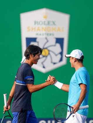 (241008) -- SHANGHAI, Oct. 8, 2024 -- Wang Aoran and Zhou Yi (L) react after the men s doubles round of 32 match between Zhou Yi Wang Aoran of China and Sadio Doumbia Fabien Reboul of France at the ATP, Tennis Herren World Tour Shanghai Masters tennis tournament in Shanghai, east China, Oct. 8, 2024. ) (SP)CHINA-SHANGHAI-TENNIS-ATP TOUR-SHANGHAI MASTERS(CN) BaixXuefei 