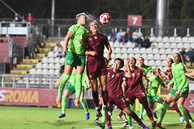 8th October 2024; Stadio Tre Fontane, Rome, Italy; UEFA Womens Champions League Football, Roma versus Wolsburg; Alexandra Popp of Wolfsburg wins the header from Evelyne Viens of AS Roma  ActionPlus12701614 AllShotLive