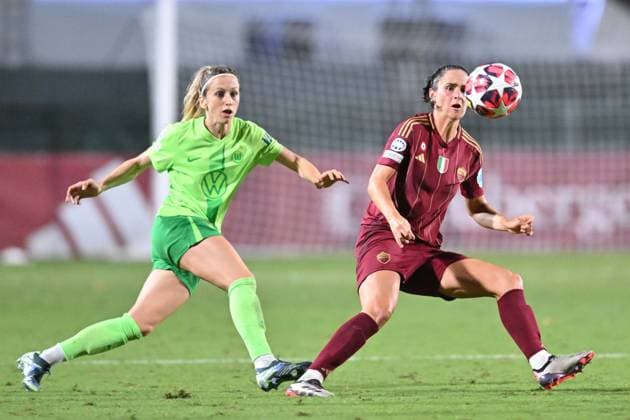 8th October 2024; Stadio Tre Fontane, Rome, Italy; UEFA Womens Champions League Football, Roma versus Wolsburg; Evelyne Viens of AS Roma controls the ball under pressure from Rebecka Blomqvist of Wolfsburg  ActionPlus12701617 AllShotLive