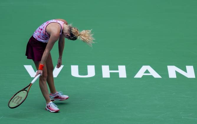 (241009) -- WUHAN, Oct. 9, 2024 -- Katerina Siniakova reacts after losing a point during the women s singles round of 32 match between Aryna Sabalenka of Belarus and Katerina Siniakova of the Czech Republic at the 2024 Wuhan Open tennis tournament in Wuhan, capital of central China s Hubei Province, Oct. 9, 2024. ) (SP)CHINA-WUHAN-TENNIS-WUHAN OPEN-WOMEN S SINGLES(CN) HuxJingwen 