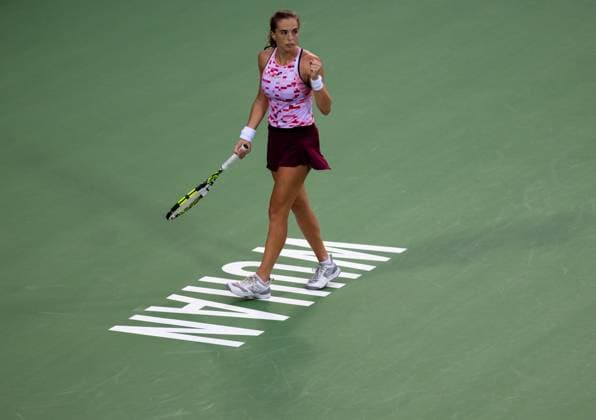 (241009) -- WUHAN, Oct. 9, 2024 -- Lucia Bronzetti celebrates during the women s singles round of 32 match between Wang Xinyu of China and Lucia Bronzetti of Italy at the 2024 Wuhan Open tennis tournament in Wuhan, capital of central China s Hubei Province, Oct. 9, 2024. ) (SP)CHINA-WUHAN-TENNIS-WUHAN OPEN-WOMEN S SINGLES(CN) HuxJingwen 