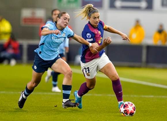 Manchester, England, 9th October 2024. Alexia Putellas of Barcelona (R) is challenged by Naomi Layzell of Manchester City during the UEFA Womens Champions League match at the Academy Stadium, Manchester. Picture credit should read: Andrew Yates Sportimage EDITORIAL USE ONLY. No use with unauthorised audio, video, data, fixture lists, club league logos or live services. Online in-match use limited to 120 images, no video emulation. No use in betting, games or single club league player publications. SPI-3368-0006