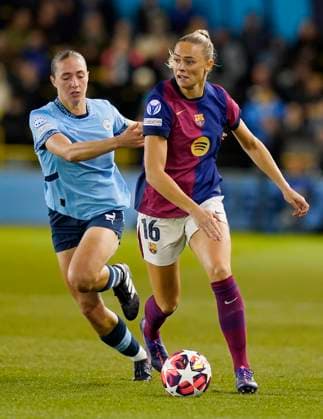 Manchester, England, 9th October 2024. Fridolina Rolfö of Barcelona (R) is challenged by Naomi Layzell of Manchester City during the UEFA Womens Champions League match at the Academy Stadium, Manchester. Picture credit should read: Andrew Yates Sportimage EDITORIAL USE ONLY. No use with unauthorised audio, video, data, fixture lists, club league logos or live services. Online in-match use limited to 120 images, no video emulation. No use in betting, games or single club league player publications. SPI-3368-0010