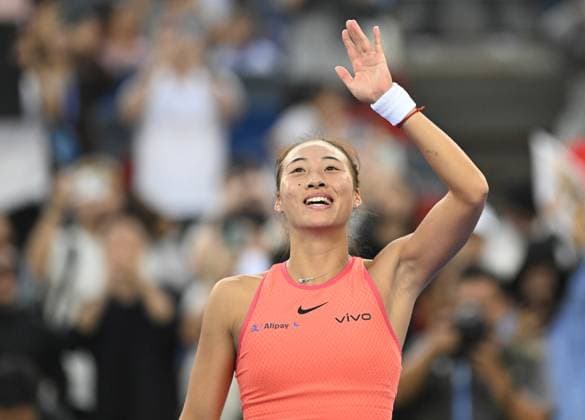 (241010) -- WUHAN, Oct. 10, 2024 -- Zheng Qinwen celebrates after the women s singles round of 16 match between Zheng Qinwen of China and Leylah Fernandez of Canada at the 2024 Wuhan Open tennis tournament in Wuhan, capital of central China s Hubei Province, Oct. 10, 2024. ) (SP)CHINA-WUHAN-TENNIS-WUHAN OPEN-WOMEN S SINGLES (CN) ChengxMin 