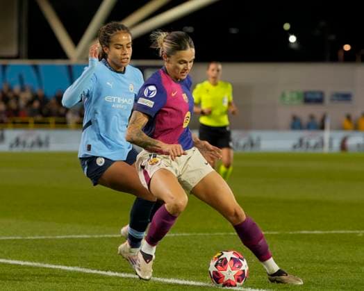 9th October 2024; Joie Stadium, Manchester, England; UEFA Womens Champions League Football, Manchester City versus Barcelona; Mapi Leon of Barcelona women shields the ball from Mary Fowler of Manchester City  ActionPlus12702071 StevenxFlynn