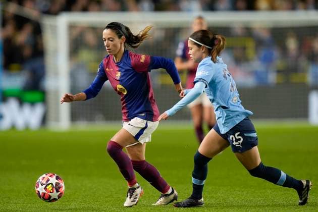 9th October 2024; Joie Stadium, Manchester, England; UEFA Womens Champions League Football, Manchester City versus Barcelona; Yui Hasegawa of Manchester City competes for the ball with Aitana Bonmati of Barcelona women  ActionPlus12702121 StevenxFlynn