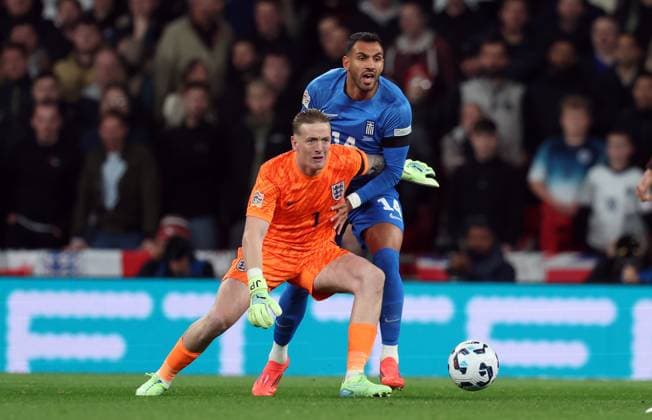 Jordan Pickford of England with Vangelis Pavlidis of Greece England v Greece - UEFA Nations League - League B - Group 2. Football. Wembey Stadium, London. UK. 10 OCT 2024 Editorial use only  Copyright: xJASONPIX Shutterstockx 14774704l