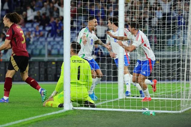Andrea Cambiaso of Italy celebrates with team mates after scoring the goal of 1-0 during the UEFA Nations League football match between Italy and Belgium at Olimpico stadium in Rome (Italy), October 10th, 2024. cesarexpurini