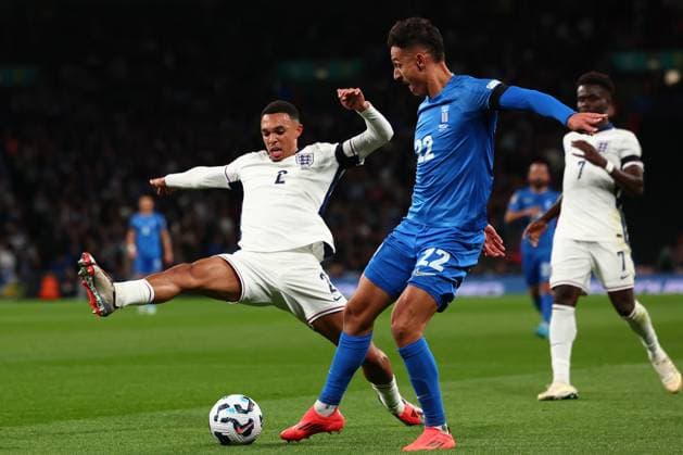 10th October 2024; Wembley Stadium, London, England; Nations League, League B, Group 2 International Football, England versus Greece; Trent Alexander-Arnold of England challenges Dimitris Giannoulis of Greece  ActionPlus12702214 ShaunxBrooks