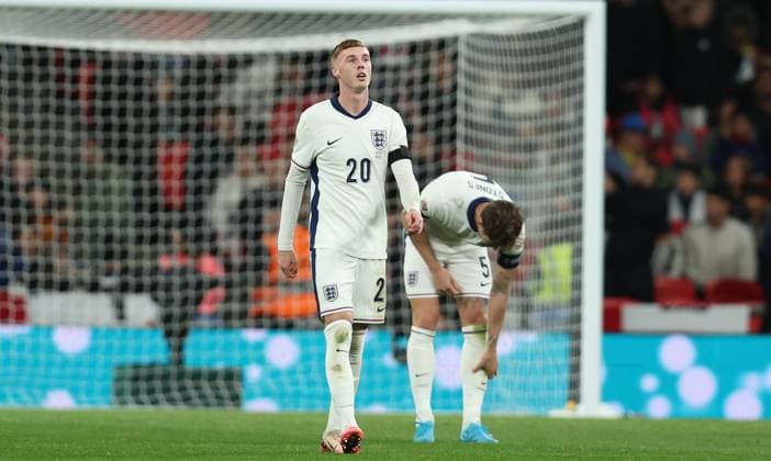 London, England, 10th October 2024. Cole Palmer of England looks Vangelis Pavlidis (not pictured) of Greece celebrates after scoring the opening goal during the UEFA Nations League match at Wembley Stadium, London. Picture credit should read: Paul Terry Sportimage EDITORIAL USE ONLY. No use with unauthorised audio, video, data, fixture lists, club league logos or live services. Online in-match use limited to 120 images, no video emulation. No use in betting, games or single club league player publications. SPI-3369-0021