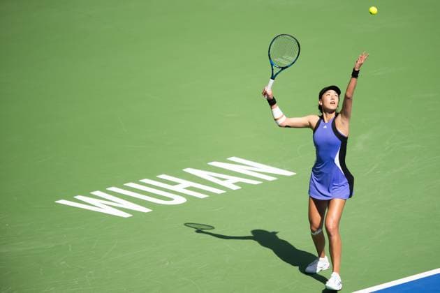 (241011) -- WUHAN, Oct. 11, 2024 -- Wang Xinyu serves during the women s singles quarterfinal between Wang Xinyu of China and Ekaterina Alexandrova of Russia at the 2024 Wuhan Open tennis tournament in Wuhan, capital of central China s Hubei Province, Oct. 11, 2024. ) (SP)CHINA-WUHAN-TENNIS-WUHAN OPEN-WOMEN S SINGLES (CN) XiaoxYijiu 