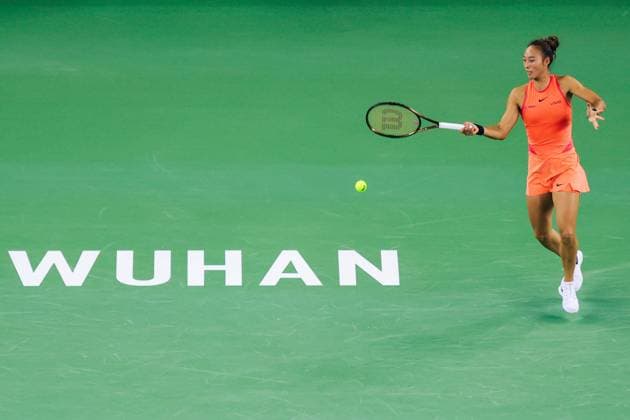 WUHAN, CHINA - OCTOBER 11: Zheng Qinwen of China competes in the Women s Singles Quarterfinal match against Jasmine Paolini of Italy on day seven of 2024 Wuhan Open at Optics Valley International Tennis Center on October 11, 2024 in Wuhan, Hubei Province of China.  Copyright: xVCGx 111523248737