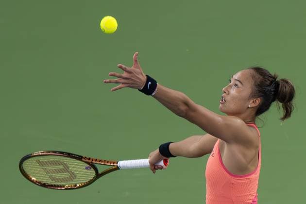(241011) -- WUHAN, Oct. 11, 2024 -- Zheng Qinwen serves during the women s singles quarterfinal match between Zheng Qinwen of China and Jasmine Paolini of Italy at the 2024 Wuhan Open tennis tournament in Wuhan, capital of central China s Hubei Province, Oct. 11, 2024. ) (SP)CHINA-WUHAN-TENNIS-WUHAN OPEN-WOMEN S SINGLES (CN) XiaoxYijiu 