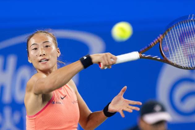 (241011) -- WUHAN, Oct. 11, 2024 -- Zheng Qinwen hits a return during the women s singles quarterfinal match between Zheng Qinwen of China and Jasmine Paolini of Italy at the 2024 Wuhan Open tennis tournament in Wuhan, capital of central China s Hubei Province, Oct. 11, 2024. ) (SP)CHINA-WUHAN-TENNIS-WUHAN OPEN-WOMEN S SINGLES (CN) XiaoxYijiu 