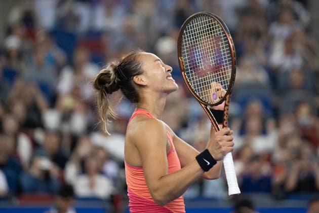 (241011) -- WUHAN, Oct. 11, 2024 -- Zheng Qinwen celebrates after the women s singles quarterfinal match between Zheng Qinwen of China and Jasmine Paolini of Italy at the 2024 Wuhan Open tennis tournament in Wuhan, capital of central China s Hubei Province, Oct. 11, 2024. ) (SP)CHINA-WUHAN-TENNIS-WUHAN OPEN-WOMEN S SINGLES (CN) XiaoxYijiu 