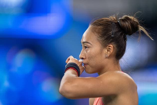 (241011) -- WUHAN, Oct. 11, 2024 -- Zheng Qinwen reacts during the women s singles quarterfinal match between Zheng Qinwen of China and Jasmine Paolini of Italy at the 2024 Wuhan Open tennis tournament in Wuhan, capital of central China s Hubei Province, Oct. 11, 2024. ) (SP)CHINA-WUHAN-TENNIS-WUHAN OPEN-WOMEN S SINGLES (CN) XiaoxYijiu 