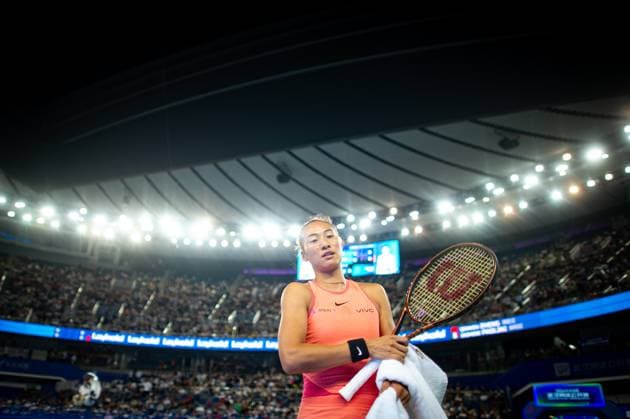 (241011) -- WUHAN, Oct. 11, 2024 -- Zheng Qinwen reacts during the women s singles quarterfinal match between Zheng Qinwen of China and Jasmine Paolini of Italy at the 2024 Wuhan Open tennis tournament in Wuhan, capital of central China s Hubei Province, Oct. 11, 2024. ) (SP)CHINA-WUHAN-TENNIS-WUHAN OPEN-WOMEN S SINGLES (CN) XiaoxYijiu 
