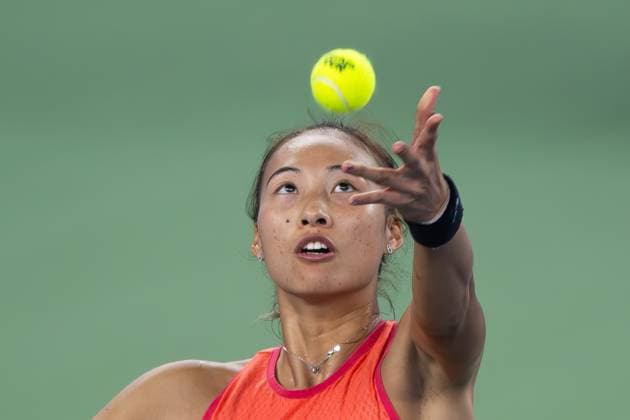 (241011) -- WUHAN, Oct. 11, 2024 -- Zheng Qinwen serves during the women s singles quarterfinal match between Zheng Qinwen of China and Jasmine Paolini of Italy at the 2024 Wuhan Open tennis tournament in Wuhan, capital of central China s Hubei Province, Oct. 11, 2024. ) (SP)CHINA-WUHAN-TENNIS-WUHAN OPEN-WOMEN S SINGLES (CN) XiaoxYijiu 