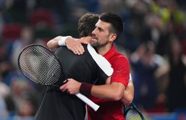 (241011) -- SHANGHAI, Oct. 11, 2024 -- Novak Djokovic (R) hugs with Jakub Mensik after the men s singles quarterfinal match between Jakub Mensik of the Czech Republic and Novak Djokovic of Serbia at the ATP, Tennis Herren World Tour Shanghai Masters tennis tournament in Shanghai, east China, Oct. 11, 2024. ) (SP)CHINA-SHANGHAI-TENNIS-ATP TOUR-SHANGHAI MASTERS(CN) XuxYanan 