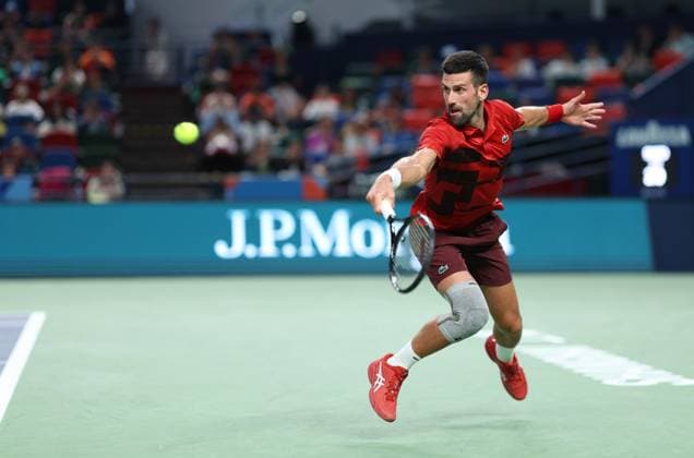 (241012) -- SHANGHAI, Oct. 12, 2024 -- Novak Djokovic hits a return during the men s singles semifinal match between Taylor Fritz of the United States and Novak Djokovic of Serbia at the ATP, Tennis Herren World Tour Shanghai Masters tennis tournament in Shanghai, east China, Oct. 12, 2024. ) (SP)CHINA-SHANGHAI-TENNIS-ATP TOUR-SHANGHAI MASTERS(CN) BaixXuefei 