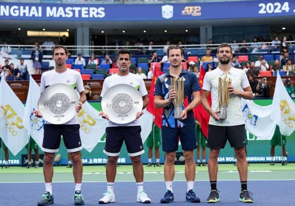 (241013) -- SHANGHAI, Oct. 13, 2024 -- Winner Wesley Koolhof (2nd R) of the Netherlands Nikola Mektic (1st R) of Croatia and runner-up Maximo Gonzalez (2nd L) Andres Molteni of Argentina pose during the awarding ceremony for the men s doubles at the ATP, Tennis Herren World Tour Shanghai Masters tennis tournament in Shanghai, east China, Oct. 13, 2024. ) (SP)CHINA-SHANGHAI-TENNIS-ATP TOUR-SHANGHAI MASTERS(CN) XuxYanan 