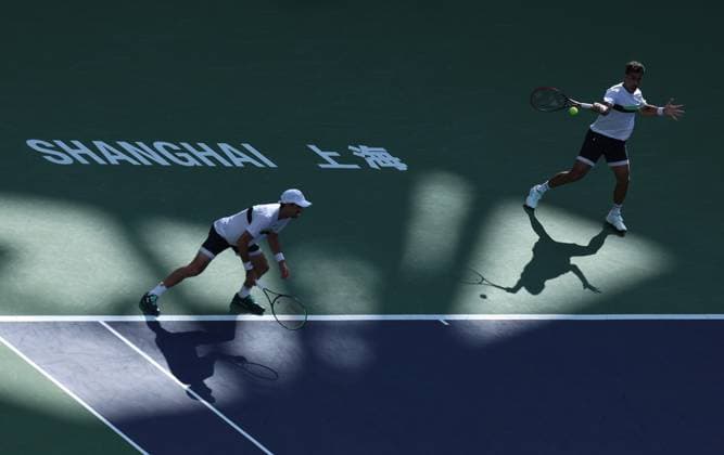 (241013) -- SHANGHAI, Oct. 13, 2024 -- Maximo Gonzalez Andres Molteni (L) of Argentina compete against Wesley Koolhof of the Netherlands Nikola Mektic of Croatia during the men s doubles final match at the ATP, Tennis Herren World Tour Shanghai Masters tennis tournament in Shanghai, east China, Oct. 13, 2024. ) (SP)CHINA-SHANGHAI-TENNIS-ATP TOUR-SHANGHAI MASTERS(CN) BaixXuefei 