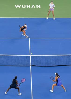 (241013) -- WUHAN, Oct. 13, 2024 -- Anna Danilina Irina Khromacheva (Top L) compete during the women s doubles final match between Anna Danilina of Kazakhstan Irina Khromacheva of Russia and Asia Muhammad Jessica Pegula of the United States at the 2024 Wuhan Open tennis tournament in Wuhan, central China s Hubei Province, Oct. 13, 2024. ) (SP)CHINA-WUHAN-TENNIS-WUHAN OPEN-WOMEN S DOUBLES-FINAL(CN) XiaoxYijiu 