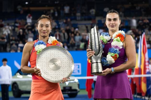 (241013) -- WUHAN, Oct. 13, 2024 -- Zheng Qinwen (L) and Aryna Sabalenka pose for photos during the awarding ceremony of women s singles final match between Zheng Qinwen of China and Aryna Sabalenka of Belarus at the 2024 Wuhan Open tennis tournament in Wuhan, central China s Hubei Province, Oct. 13, 2024. ) (SP)CHINA-WUHAN-TENNIS-WUHAN OPEN-WOMEN S SINGLES-FINAL(CN) XiaoxYijiu 