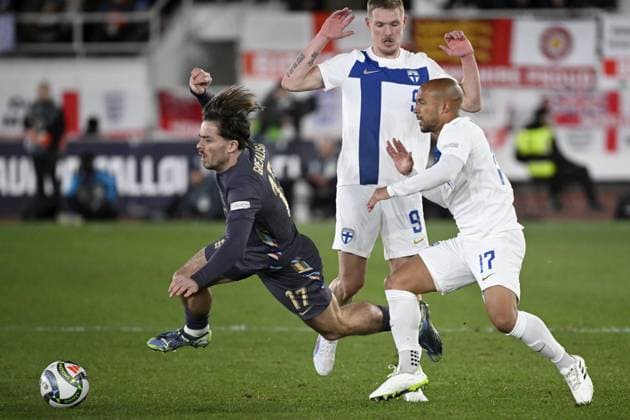 Jack Grealish (L) of England falls as Fredrik Jensen (C) and Nikolai Alho of Finland follow during the UEFA Nations League, League B - Group 2, football match between Finland and England at the Olympic Stadium in Helsinki, Finland, on October 13, 2024. Helsinki Finland LKFTJK20241013191049TVZS  Copyright: xAnttixAimo-Koivistox LKFTJK20241013191049TVZS