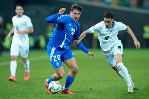 Andrea Cambiaso (Italy) and Dolev Haziza (Israel) battle for the ball, UEFA Nations League 2024 25 League A Group A2, Italy v Israel, Stadio Friuli, October 14, 2024, Udine, Italy.
