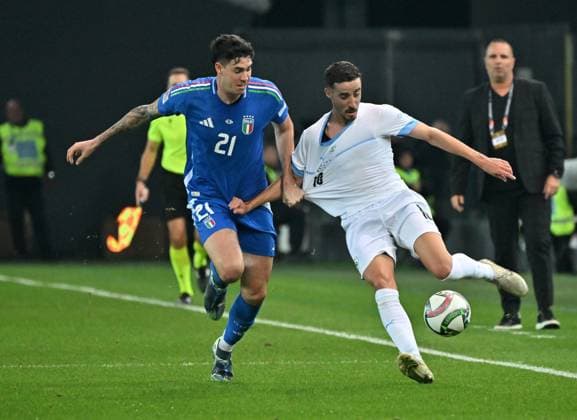 (241015) -- UDINE, Oct. 15, 2024 -- Alessandro Bastoni (L) of Italy vies against Dolev Haziza of Israel during the UEFA Nations League 2024 25 League A Group A2 match between Italy and Israel in Udine, Italy, Oct. 14, 2024. (Photo by Xinhua) (SP)ITALY-UDINE-FOOTBALL-UEFA NATIONS LEAGUE A-ITALY VS ISRAEL DiegoxPetrussi 