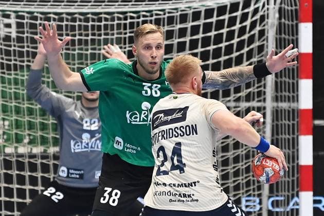 From left Matej Nantl of Karvina, Jim Gottfridsson of Flensburg in action during the Men s European Handball League match Group G 2nd round match: Karvina vs Flensburg in Karvina, Czech Republic, October 15, 2024. (CTKxPhoto JaroslavxOzana) CTKPhotoP2024101508088  CTKPhotoP2024101508088