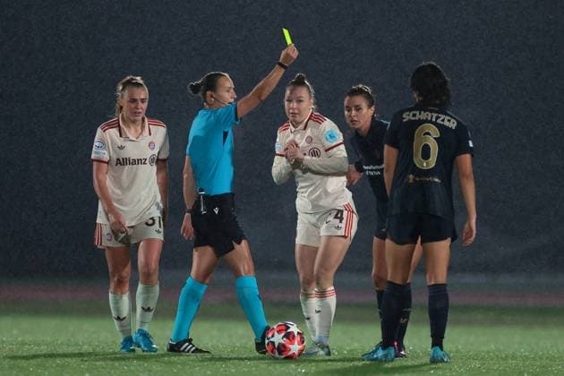 Biella, Italy, 16th October 2024. Cristiana Girelli of Juventus is shown a yellow card by the Referee Ivana Projkovska of Macedonia for a foul on Weronika Zawistowska of Bayern Munchen during the UEFA Womens Champions League match at Stadio Comunale Vittorio Pozzo Lamarmora, Biella. Picture credit should read: Jonathan Moscrop Sportimage EDITORIAL USE ONLY. No use with unauthorised audio, video, data, fixture lists, club league logos or live services. Online in-match use limited to 120 images, no video emulation. No use in betting, games or single club league player publications. SPI-3372-0008