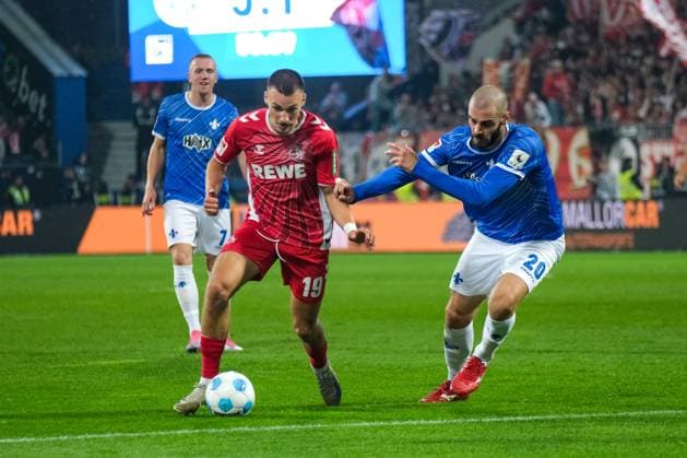 Tim Lemperle 1 FC Koeln, 19 in duel with Aleksandar Vukotic SV Darmstadt 98, 20 , GER, SV Darmstadt 98 vs 1 FC Koeln, Soccer, 2 Bundesliga, Matchday 9, Season 2024 2025, 18 10 2024 DFL REGULATIONS PROHIBIT ANY USE OF PHOTOGRAPHS as IMAGE SEQUENCES and or QUASI VIDEO GER, SV Darmstadt 98 vs 1 FC Koeln, Football, 2 Bundesliga, Matchday 9, Season 2024 2025, 18 10 2024 Darmsatdt Copyright: xEibner-Pressefoto FlorianxWieganx EP_FWD