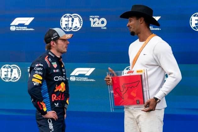 Dutch Formula One driver Max Verstappen of Red Bull Racing speaks German track and field athlete Leo Neugebauer following sprint qualifying during for the Formula One United States Grand Prix at the Circuit of the Americas in Austin, Texas on Friday, October 18, 2024.  AUS2024101866 GREGxNASH