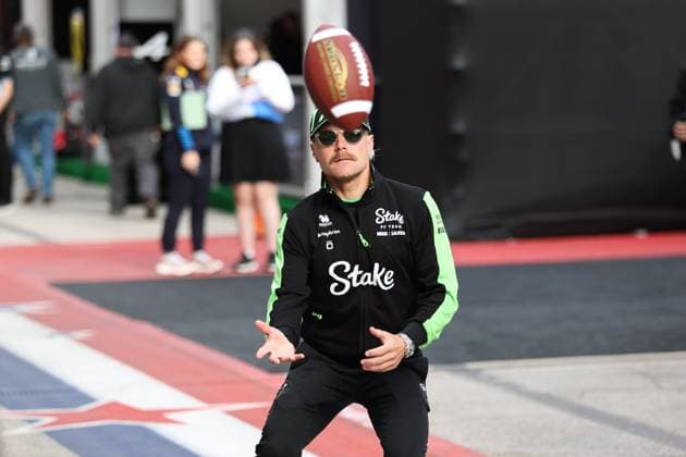 F1 Grand Prix Of USA - Sprint Qualifying Valtteri Bottas attempts to catch an American football as he walks through the paddock at Circuit of the Americas in Austin, Texas, on October 18, 2024, during the Formula 1 Pirelli United States Grand Prix. Austin, Texas United States  Copyright: xReginaldxMathalonex originalFilename:mathalone-notitle241018_npzgY.jpg