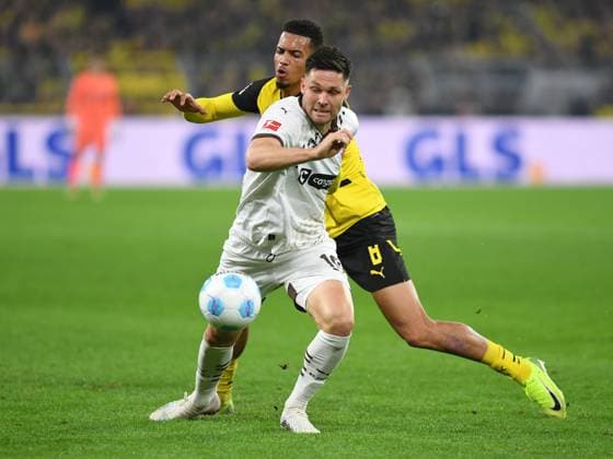 Andreas Albers FC St Pauli and Felix Nmecha Borussia Dortmund in a duel during the Bundesliga 1 match between Borussia Dortmund and FC St Pauli 1910, SIGNAL IDUNA PARK on October 18, 2024 in Dortmund, Germany Photo by Ralf Treese DeFodi Images Andreas Albers FC St Pauli and Felix Nmecha Borussia Dortmund battle for the ball during the Bundesliga match between Borussia Dortmund and FC St Pauli 1910 at Signal Iduna Park on October 18, 2024 in Dortmund, Germany Photo by Ralf Treese DeFodi Images DFL regulations prohibit any use of photographs as image sequences and or quasi video not used in POL SRB CRO FRA GBR NED ITA USA Defodi 521 BVBSTP20241018 075 Defodi-521 not used in POL SRB CRO FRA GBR NED ITA USA DFL regulations prohibit any use of photographs as image sequences and or quasi-video.