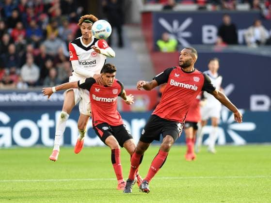 Hugo Ekitike Eintracht Frankfurt , Piero Hincapie Bayer 04 Leverkusen and Jonathan Tah Bayer 04 Leverkusen battle for the ball during the Bundesliga match between Bayer 04 Leverkusen and Eintracht Frankfurt at BayArena on October 19, 2024 in Leverkusen, Germany Photo by Ralf Treese DeFodi Images Hugo Ekitike Eintracht Frankfurt , Piero Hincapie Bayer 04 Leverkusen and Jonathan Tah Bayer 04 Leverkusen battle for the ball during the Bundesliga match between Bayer 04 Leverkusen and Eintracht Frankfurt at BayArena on October 19, 2024 in Leverkusen, Germany Photo by Ralf Treese DeFodi Images DFL regulations prohibit any use of photographs as image sequences and or quasi video not used in POL SRB CRO FRA GBR NED ITA USA Defodi 521 LEVFRA20241019 046 Defodi-521 not used in POL SRB CRO FRA GBR NED ITA USA DFL regulations prohibit any use of photographs as image sequences and or quasi-video.