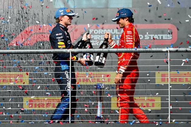 AUSTIN, TX - OCTOBER 20: Oracle Red Bull Racing driver Max Verstappen (1) of the Netherlands and Scuderia Ferrari driver Carlos Sainz (55) of Spain clank champagne bottles to celebrate their podium finish following the Formula 1 Pirelli United States Grand Prix on October 20, 2024, at Circuit of The Americas in Austin, Texas. (Photo by Ken Murray Icon Sportswire) AUTO: OCT 20 F1 Pirelli United States Grand Prix EDITORIAL USE ONLY Icon241020018