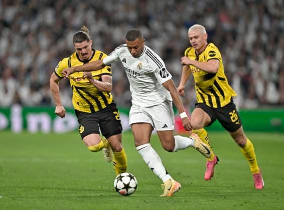 22 10 2024, Football UEFA Champions League 2024 2025, Matchday 3, Real Madrid Borussia Dortmund, at Estadio Santiango Bernabeu in Madrid Spain , from l Marcel Sabitzer Borussia Dortmund , Kylian Mbappe Real Madrid and Julian Ryerson Borussia Dortmund in a duel for the ball DFL and DFB regulations prohibit any use of photographs as image sequences and or quasi video