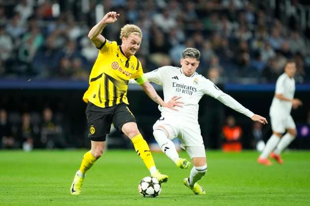 Real Madrid C.F. v Borussia- UEFA Champions League 2024 25 League Phase MD3 Julian Brandt attacking midfield of Borussia Dortmund and Germany and Federico Valverde central midfield of Real Madrid and Uruguay compete for the ball during the UEFA Champions League 2024 25 League Phase MD3 match between Real Madrid C.F. and Borussiaat Estadio Santiago Bernabeu on October 22, 2024 in Madrid, Spain. Madrid Spain  Copyright: xJosexBretonx originalFilename:bretonhernandez-realmadr241022_np6DK.jpg