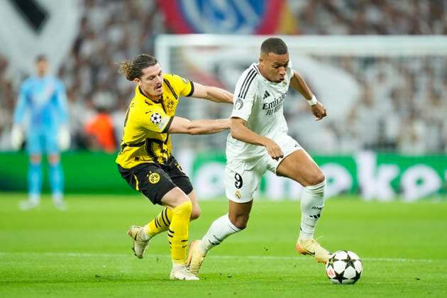 Real Madrid C.F. v Borussia- UEFA Champions League 2024 25 League Phase MD3 Kylian Mbappe centre-forward of Real Madrid and France and Marcel Sabitzer central midfield of Borussia Dortmund and Austria compete for the ball during the UEFA Champions League 2024 25 League Phase MD3 match between Real Madrid C.F. and Borussiaat Estadio Santiago Bernabeu on October 22, 2024 in Madrid, Spain. Madrid Spain  Copyright: xJosexBretonx originalFilename:bretonhernandez-realmadr241022_npqx5.jpg